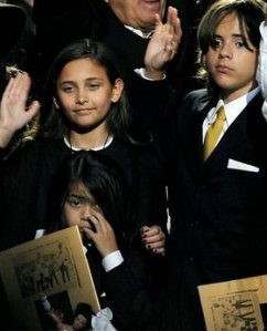 Michael Jackson's daughter Paris, left,  and two sons Prince Michael Jackson II  and Prince Michael Jackson I, right,  wave at the end of a memorial service for their father Michael Jackson at Staples Center on Tuesday, July 7, 2009 in Los Angeles.  (AP Photo/Gabriel Bouys, Pool)